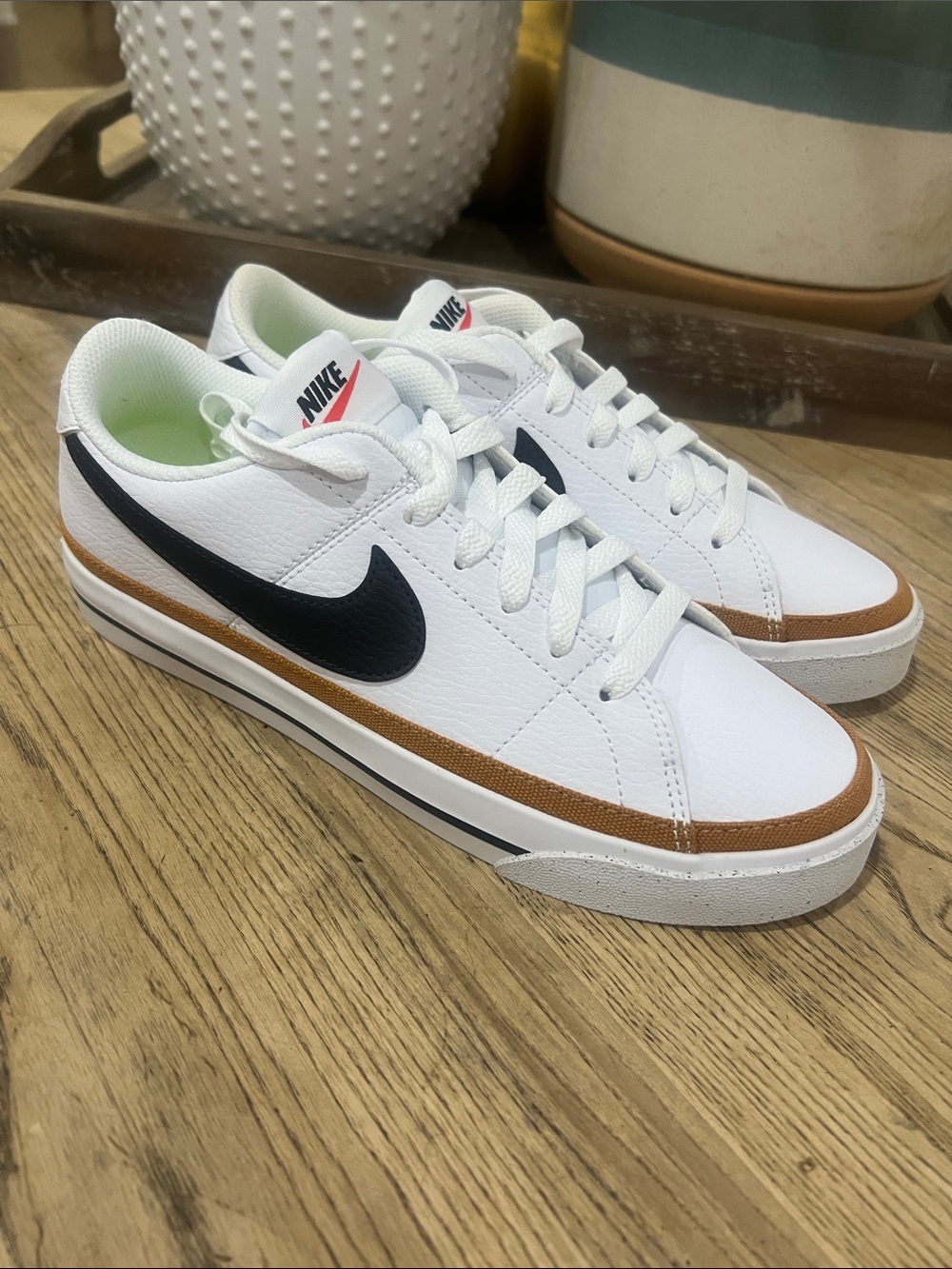 Nike Women’s White Sneakers with Black Swoosh and Brown Trim